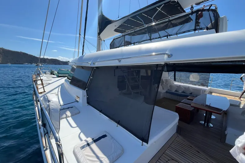 Sunreef 60 Yacht Photos Pics Luxurious 2005 Sunreef 60 yacht with spacious deck and seating area on the water.