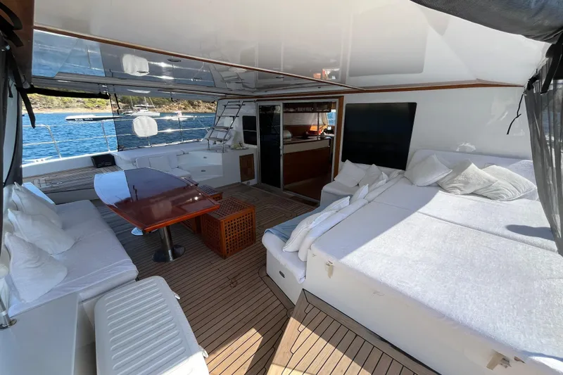 Sunreef 60 Yacht Photos Pics Luxurious Sunreef 60 yacht interior, featuring spacious seating and elegant wooden table, 2005 model.