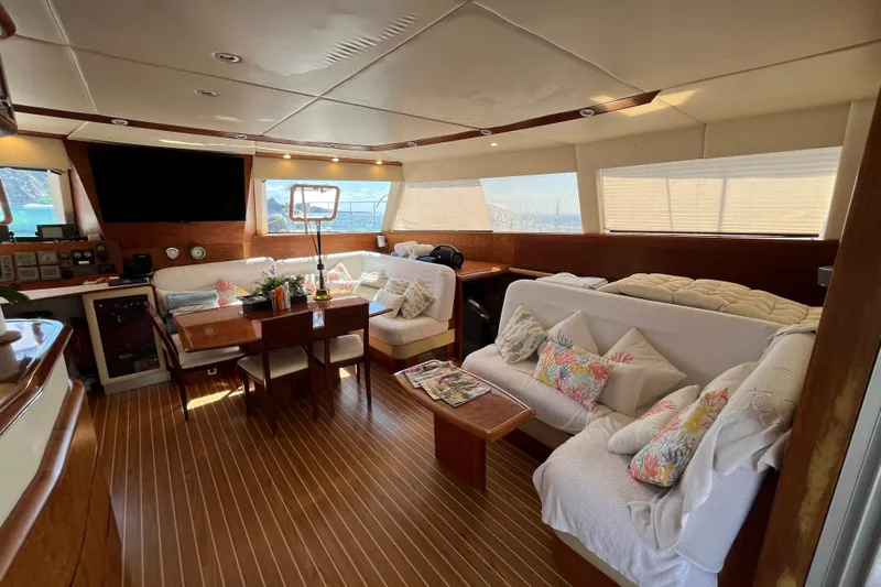 Sunreef 60 Yacht Photos Pics Luxurious interior of 2005 Sunreef 60 yacht with elegant seating and wooden finishes.