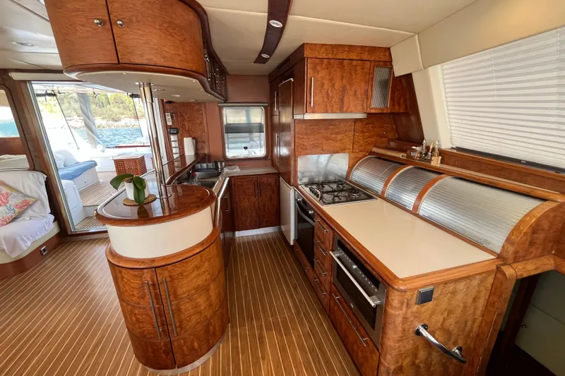 Sunreef 60 Yacht Photos Pics Luxurious Sunreef 60 yacht kitchen interior, featuring elegant wood finishes and modern appliances, 2005 model.