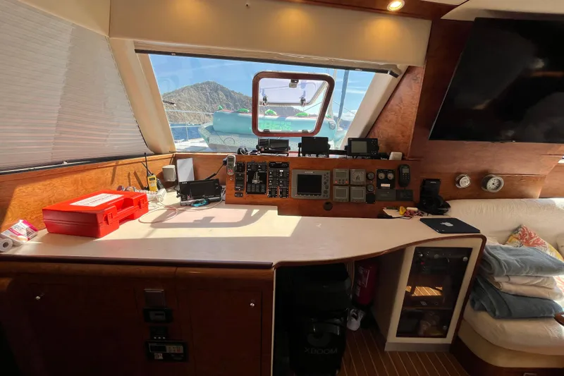 Sunreef 60 Yacht Photos Pics Interior view of 2005 Sunreef 60 yacht cockpit with navigation equipment and scenic window.