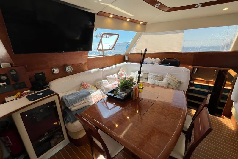 Sunreef 60 Yacht Photos Pics Luxurious interior of 2005 Sunreef 60 yacht with elegant dining area and plush seating.