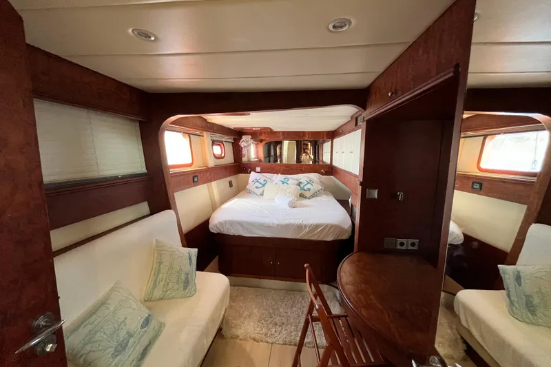 Sunreef 60 Yacht Photos Pics Luxurious cabin interior of a 2005 Sunreef 60 yacht with cozy bed and seating.