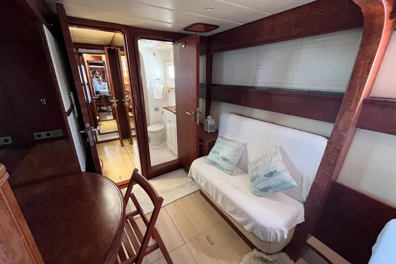 Sunreef 60 Yacht Photos Pics Luxurious interior of 2005 Sunreef 60 yacht with cozy seating and elegant wood finishes.