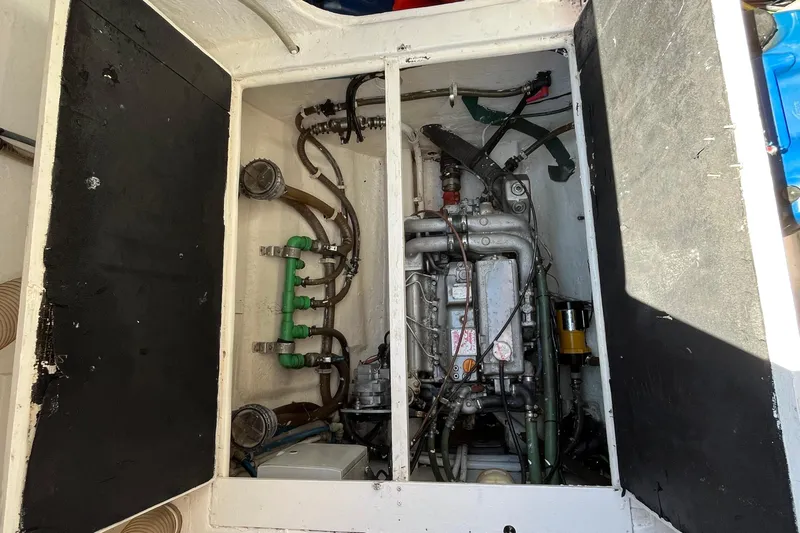 Sunreef 60 Yacht Photos Pics Engine compartment of a 2005 Sunreef 60 yacht, showcasing mechanical components and piping.