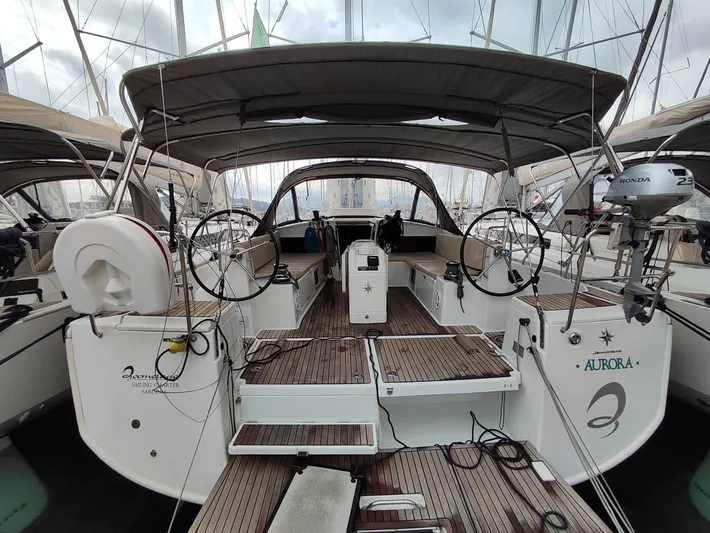 Aurora Yacht Photos Pics 2018 Jeanneau Sun Odyssey 490 sailboat with dual steering wheels and spacious cockpit.