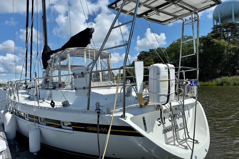 Su Ching Yacht Photos Pics 1984 Tayana 55 sailboat docked, featuring sleek design and clear skies.