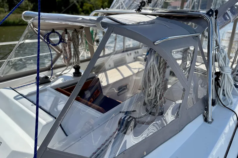 Su Ching Yacht Photos Pics 1984 Tayana 55 sailboat cockpit with ropes and clear canopy.