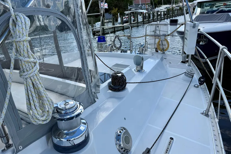 Su Ching Yacht Photos Pics 1984 Tayana 55 sailboat deck with winches and ropes, docked at a marina.