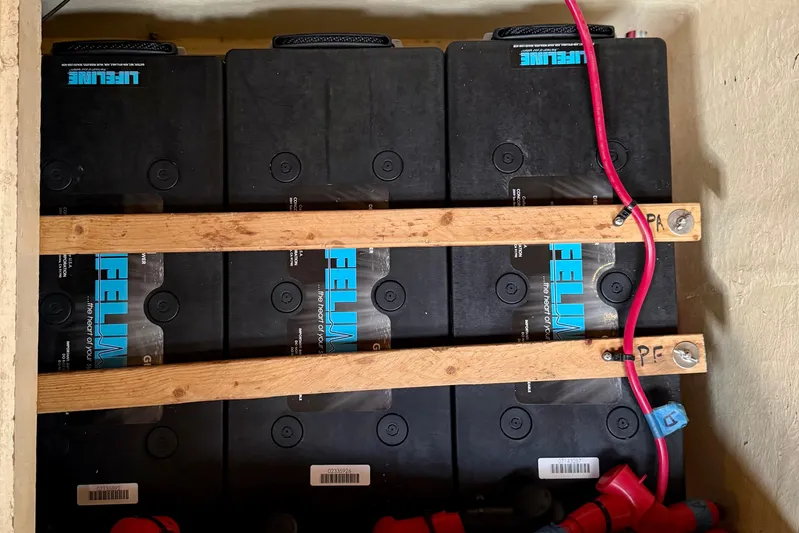 Su Ching Yacht Photos Pics Battery compartment of a 1984 Tayana 55 yacht with Lifeline batteries and red wiring.