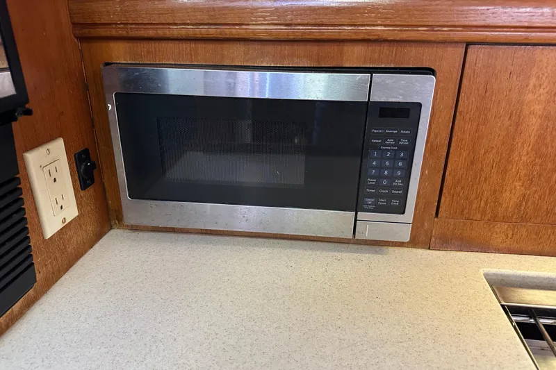 Mischievous Mermaid Yacht Photos Pics Built-in microwave in 2004 Hunter Deck Salon yacht kitchen.