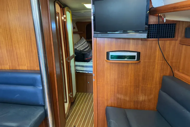 Mischievous Mermaid Yacht Photos Pics Interior of 2004 Hunter Deck Salon yacht with wood paneling and modern amenities.