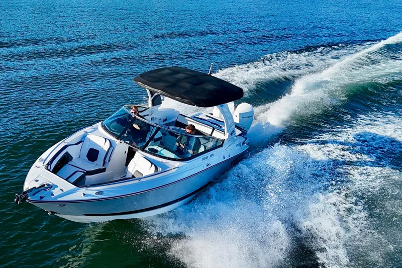  Yacht Photos Pics 2023 Monterey 305SS Super Sport boat cruising on open water.