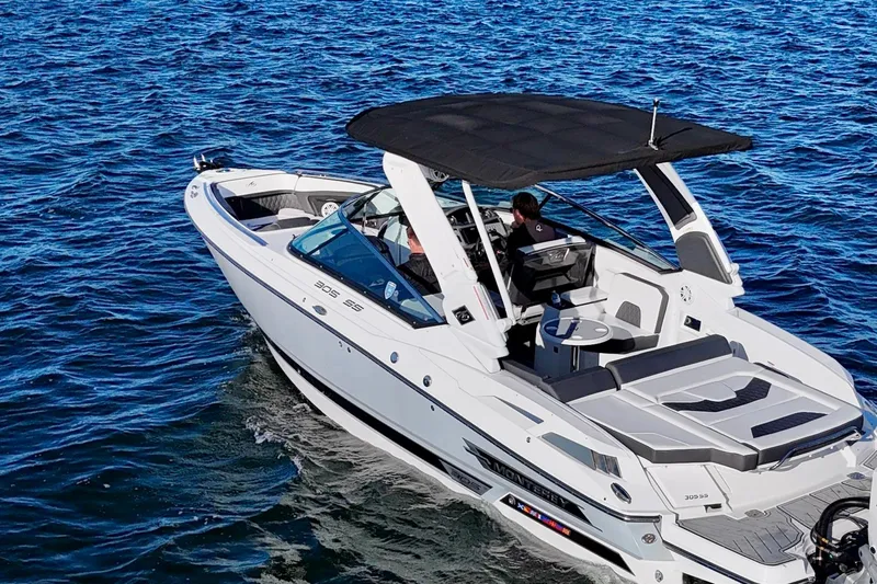  Yacht Photos Pics 2023 Monterey 305SS Super Sport boat cruising on open water.