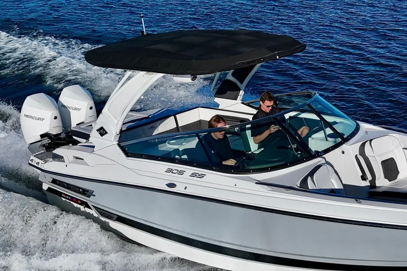  Yacht Photos Pics 2023 Monterey 305SS Super Sport boat cruising on open water.