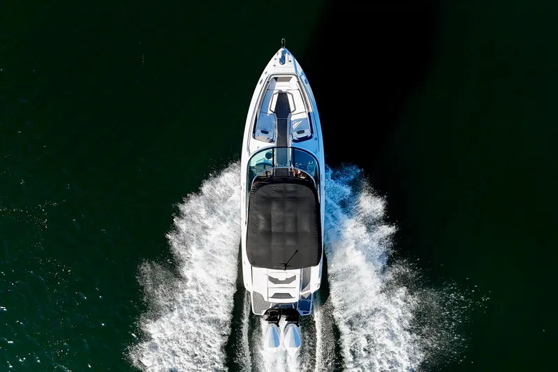 Yacht Photos Pics Aerial view of 2023 Monterey 305SS Super Sport boat cruising on water.
