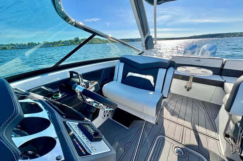  Yacht Photos Pics 2023 Monterey 305SS Super Sport boat interior with luxurious seating and modern controls.