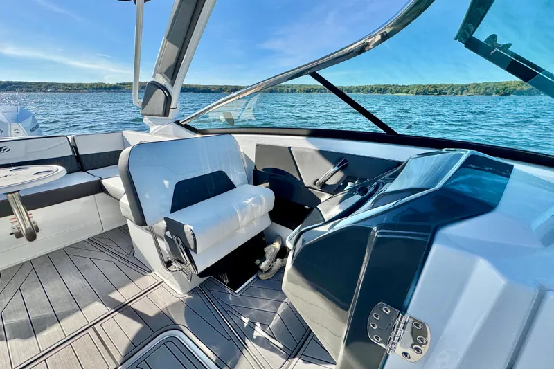  Yacht Photos Pics 2023 Monterey 305SS Super Sport boat interior with sleek seating and modern dashboard.