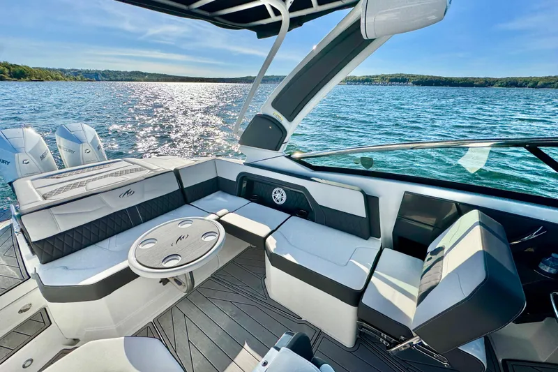  Yacht Photos Pics 2023 Monterey 305SS Super Sport boat interior with luxurious seating and scenic water view.