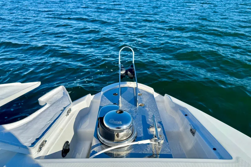  Yacht Photos Pics 2023 Monterey 305SS Super Sport boat on water, featuring a sleek deck design.