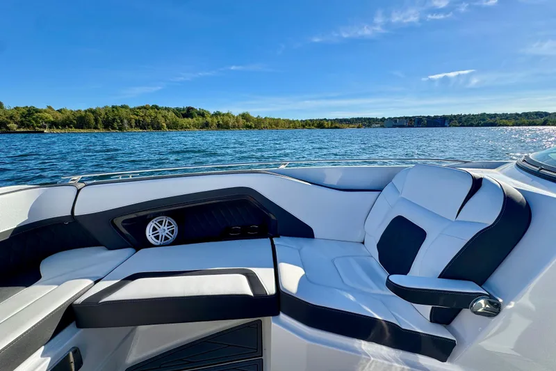  Yacht Photos Pics 2023 Monterey 305SS Super Sport boat interior with luxurious seating on a sunny day.