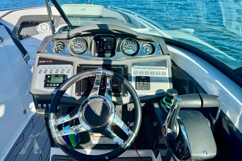  Yacht Photos Pics Cockpit of 2023 Monterey 305SS Super Sport boat with advanced controls and steering wheel.