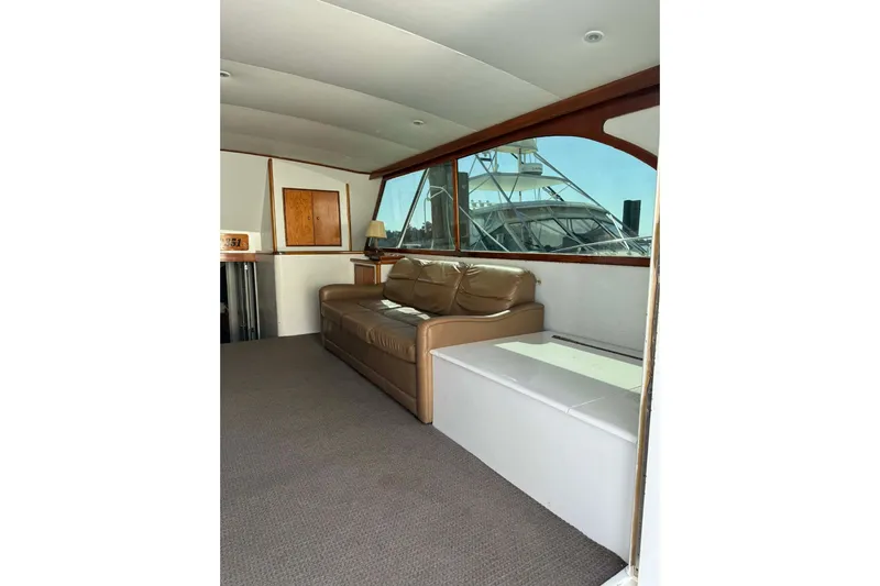 Yacht Photos Pics Interior of 1992 Blackwell Custom Carolina yacht with leather sofa and large window.