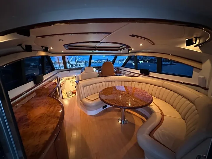  Yacht Photos Pics Luxurious interior of 2006 Neptunus 55 Royale yacht with elegant seating and wood finishes.