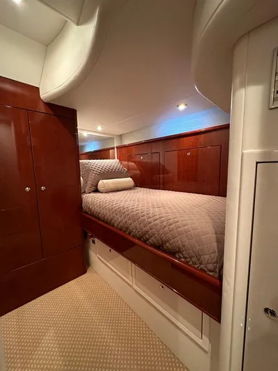  Yacht Photos Pics Luxurious cabin interior of 2006 Neptunus 55 Royale yacht with elegant wood finish.