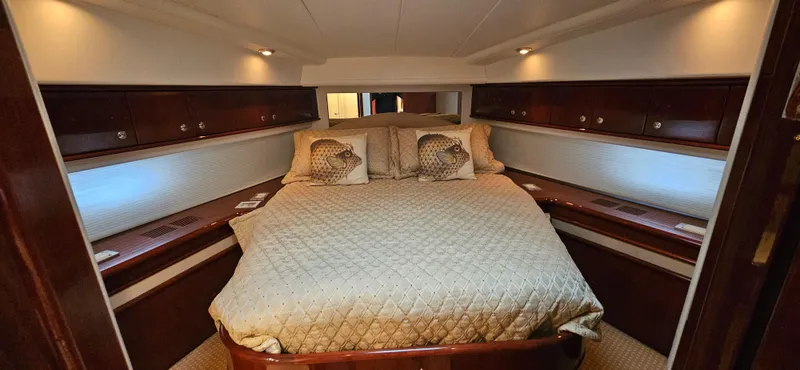  Yacht Photos Pics Luxurious bedroom interior of 2006 Neptunus 55 Royale yacht with elegant bedding.