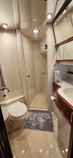  Yacht Photos Pics Luxurious bathroom in 2006 Neptunus 55 Royale yacht with modern fixtures and elegant design.