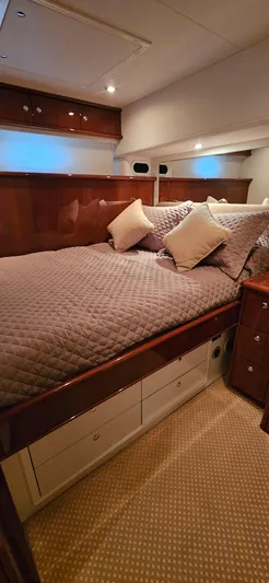  Yacht Photos Pics Luxurious bedroom interior of 2006 Neptunus 55 Royale yacht with plush bedding.