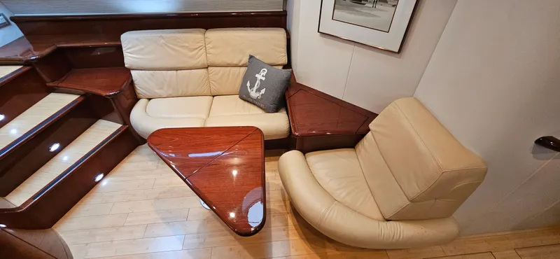  Yacht Photos Pics Luxurious interior of a 2006 Neptunus 55 Royale yacht with leather seating and wooden accents.