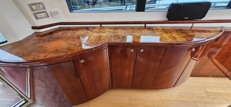  Yacht Photos Pics Luxurious wood cabinetry in 2006 Neptunus 55 Royale yacht interior.