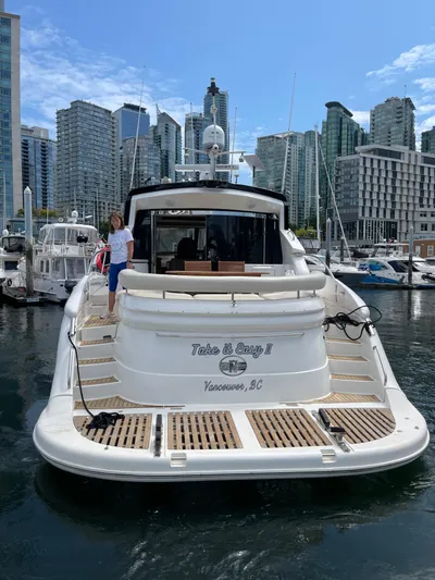  Yacht Photos Pics 2006 Neptunus 55 Royale yacht docked in Vancouver marina with city skyline.