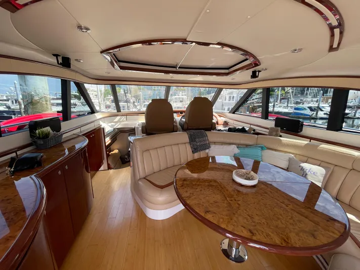  Yacht Photos Pics Luxurious interior of 2006 Neptunus 55 Royale yacht with elegant seating and panoramic windows.
