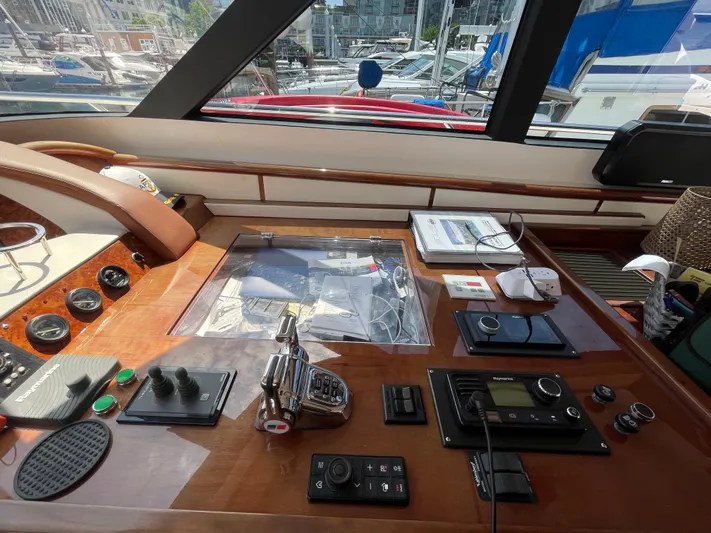  Yacht Photos Pics Control panel of a 2006 Neptunus 55 Royale yacht with navigation equipment.