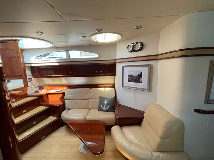  Yacht Photos Pics Luxurious interior of 2006 Neptunus 55 Royale yacht with leather seating and elegant wood finishes.