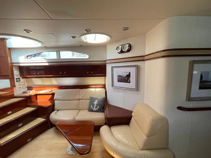  Yacht Photos Pics Luxurious interior of 2006 Neptunus 55 Royale yacht with leather seating and elegant wood finishes.