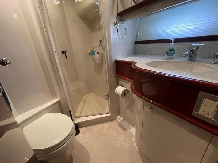  Yacht Photos Pics Luxurious bathroom in 2006 Neptunus 55 Royale yacht with shower and vanity.