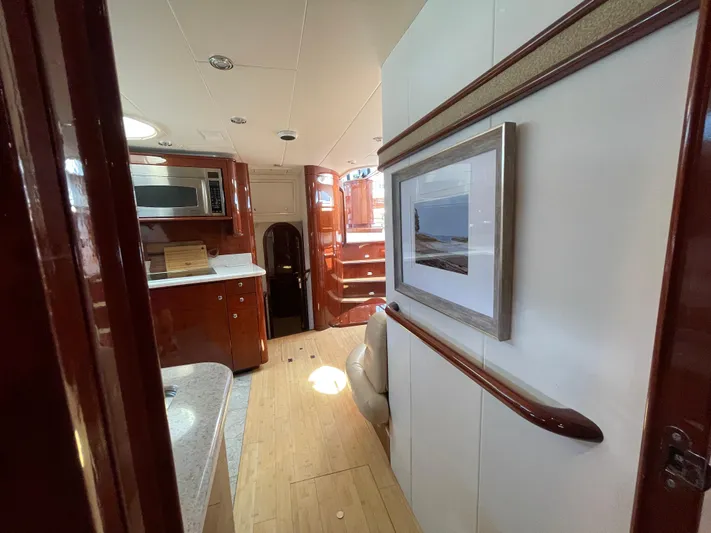  Yacht Photos Pics Luxurious interior of 2006 Neptunus 55 Royale yacht with modern kitchen and elegant decor.