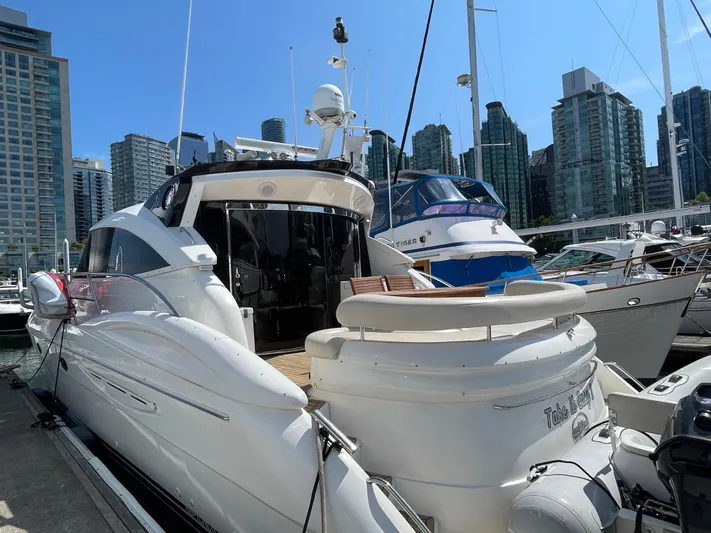  Yacht Photos Pics Luxury 2006 Neptunus 55 Royale yacht docked in urban marina setting.