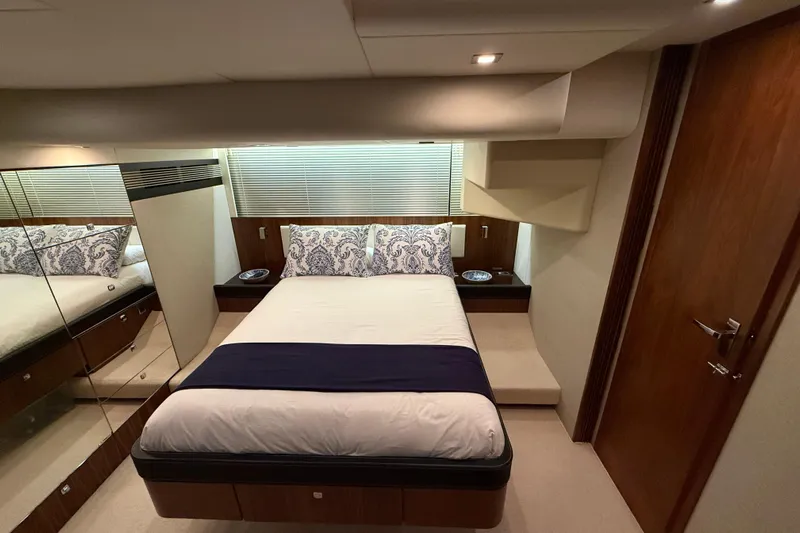 Marckeric Yacht Photos Pics Luxurious bedroom interior of 2012 Fairline Squadron 58 yacht with elegant bedding and wood accents.