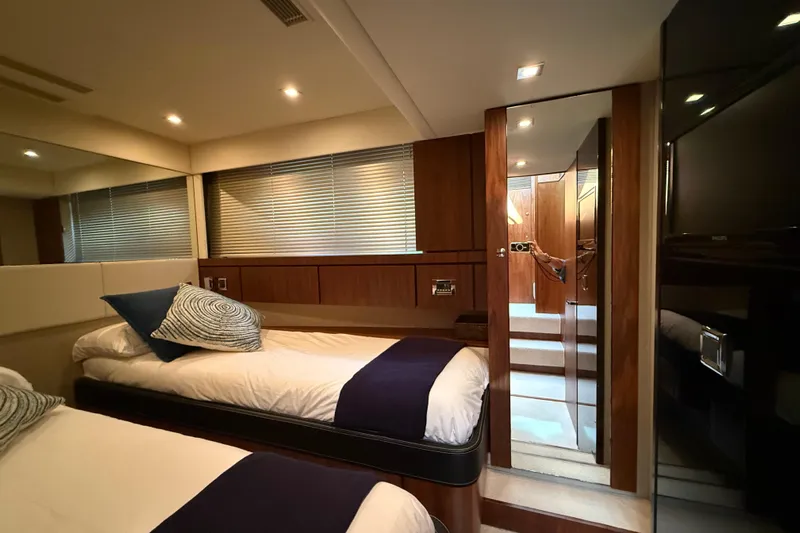 Marckeric Yacht Photos Pics Luxurious cabin interior of 2012 Fairline Squadron 58 yacht with twin beds and modern decor.