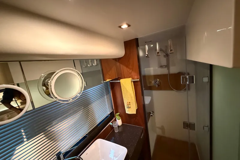 Marckeric Yacht Photos Pics Luxurious bathroom in 2012 Fairline Squadron 58 yacht with modern fixtures and elegant design.