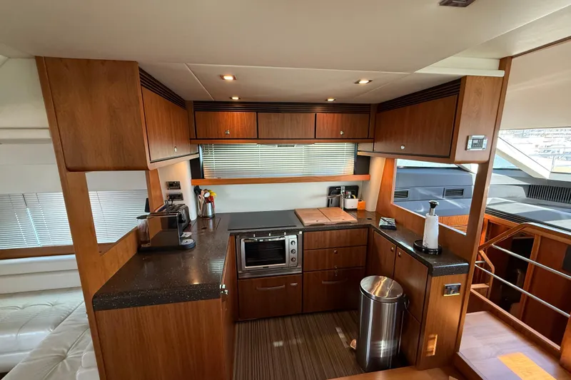 Marckeric Yacht Photos Pics Luxurious kitchen interior of 2012 Fairline Squadron 58 yacht with modern amenities.