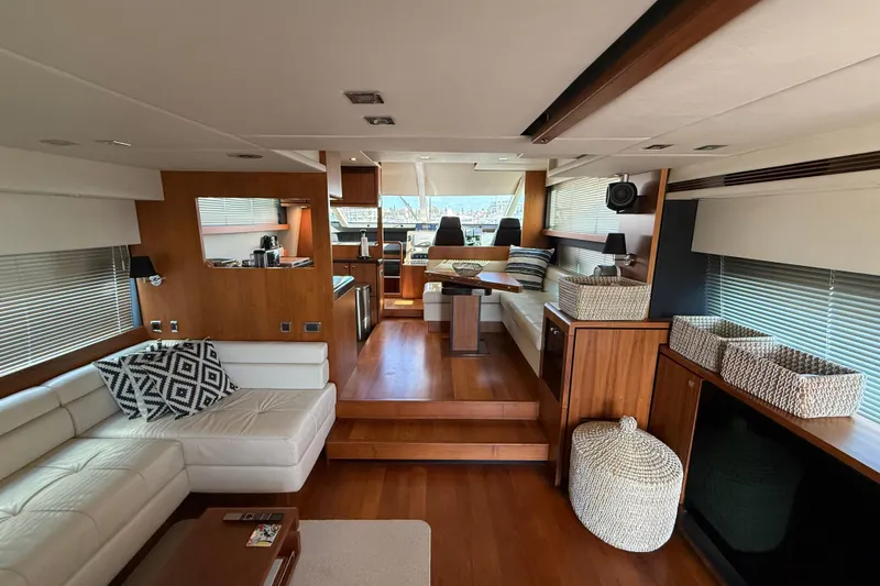 Marckeric Yacht Photos Pics Luxurious interior of 2012 Fairline Squadron 58 yacht with elegant wood finishes and modern furnishings.