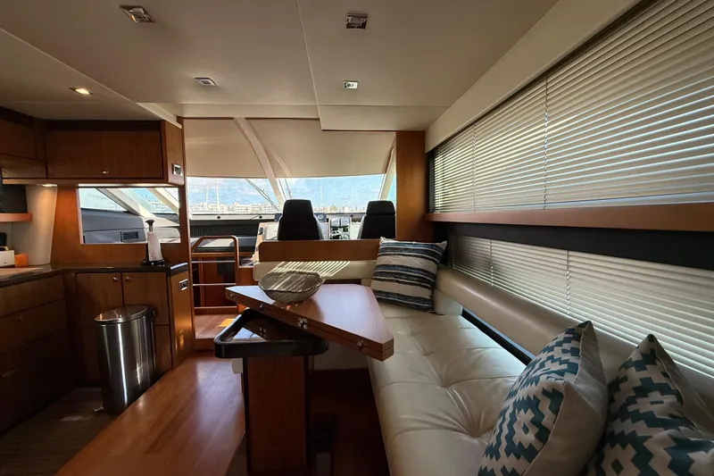 Marckeric Yacht Photos Pics Luxurious interior of 2012 Fairline Squadron 58 yacht with modern seating and elegant decor.