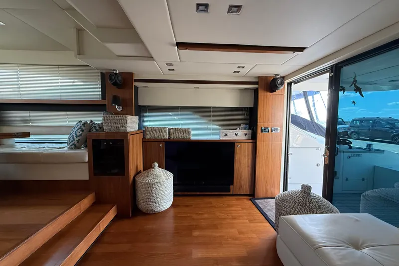 Marckeric Yacht Photos Pics Luxurious interior of 2012 Fairline Squadron 58 yacht with modern wood finishes and large windows.