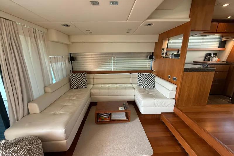 Marckeric Yacht Photos Pics Luxurious interior of 2012 Fairline Squadron 58 yacht with elegant white leather seating.